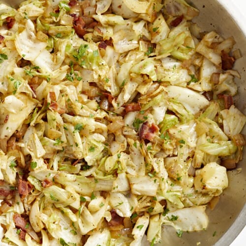 Close up overhead view of fried cabbage in a skillet.